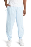 Nike Sportswear Solo Swoosh Nylon Track Pants In Celestine Blue/ White