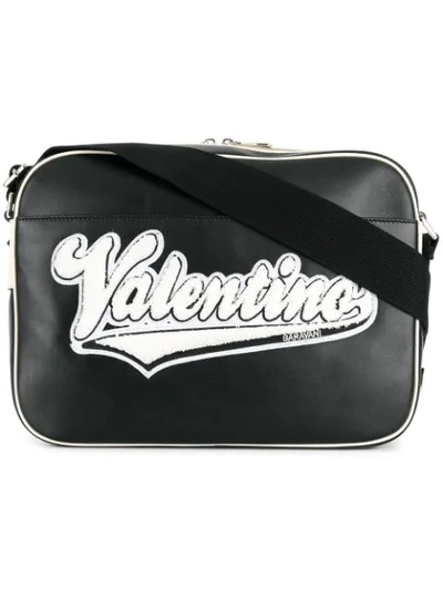 Valentino Garavani Leather Messenger Bag With Embroidered Logo In Nero Avorionero