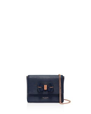 navy and rose gold bag