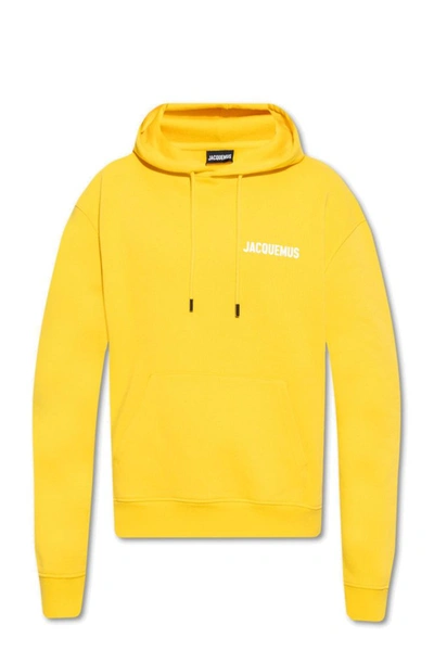 Jacquemus Logo Print Drawstring Hoodie In Yellow