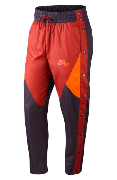 Nike Sportswear Tearaway Woven Pants In Port Wine/team Orange