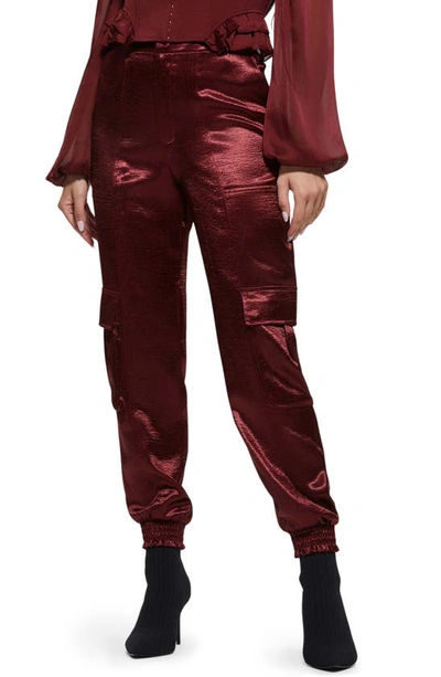 Guess Soundwave Textured Satin Cargo Pants In Mystic Wine