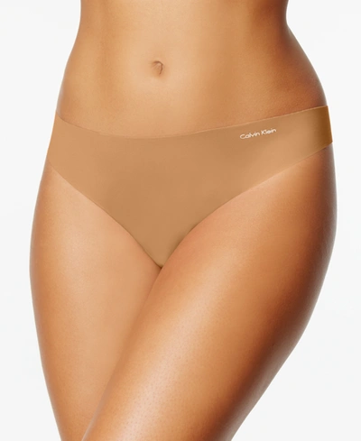 Calvin Klein Women's Invisibles Thong Underwear D3428 In Bronze