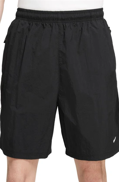 Nike Solo Swoosh Water Repellent Stretch Nylon Shorts In Black