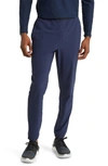 Rhone Slim Fit Versatility Pants In Nero Black In Navy