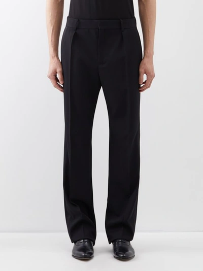 Saint Laurent Tapered Pleated Wool Trousers In Black
