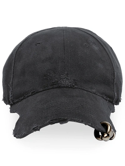 Balenciaga Piercing Distressed Cap In Black