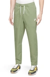 Nike Men's Club Woven Tapered Leg Pants In Oil Green/white