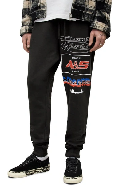Allsaints Teamster Organic Cotton Graphic Joggers In Washed Black