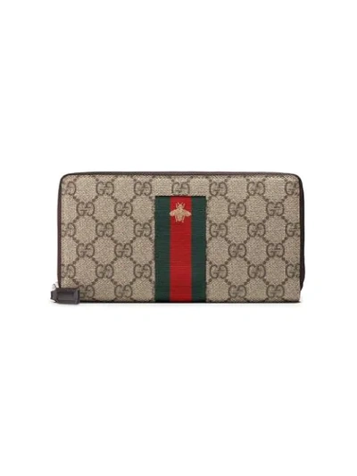 Gucci Web Gg Supreme Zip Around Wallet In Brown