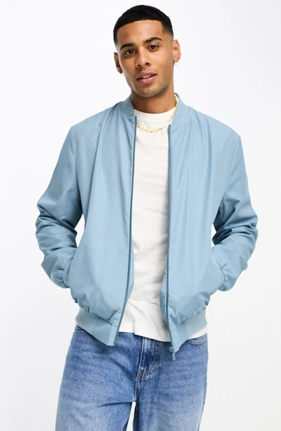 ASOS DESIGN oversized varsity cotton bomber jacket in green with embroidery  badging
