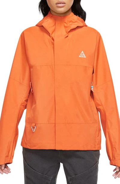 Nike Women's  Acg "cascade Rain" Storm-fit Water-resistant Lightweight Jacket In Orange