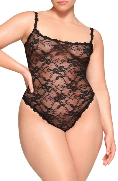 Skims Stretch Lace Thong Bodysuit In Onyx