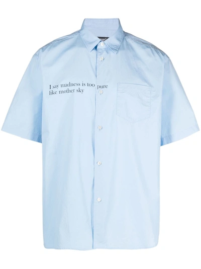 Undercover Madness Slogan-print Shirt In <p>light Blue Cotton Shirt From  Featuring Short Sleeves, Button Closure, Chest Pocket, Cl