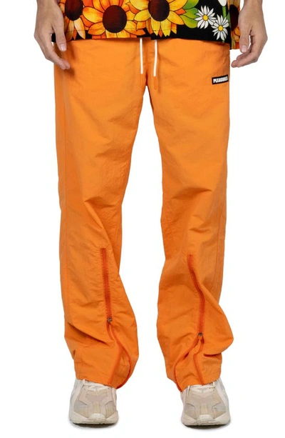 Pleasures Gaze Nylon Track Pants In Orange