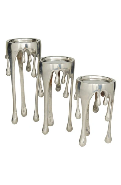 Cosmo By Cosmopolitan Silver Aluminum Pillar Candle Holder With Dripping Melting Designed Legs
