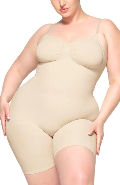 Skims Seamless Sculpt Low Back Mid Thigh Bodysuit In Sand