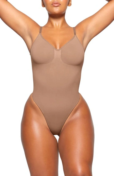 Skims Seamless Sculpt Low Back Thong Bodysuit In Sienna