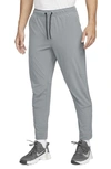 Nike Men's Unlimited Dri-fit Zippered Cuff Versatile Pants In Grey