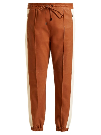 Isabel Marant Coy Side-stripe Leather Track Pants In Terracotta Brown, Cream