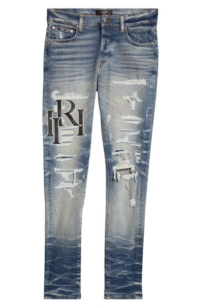 Amiri Destroyed Jeans With Staggered Logo In Blue