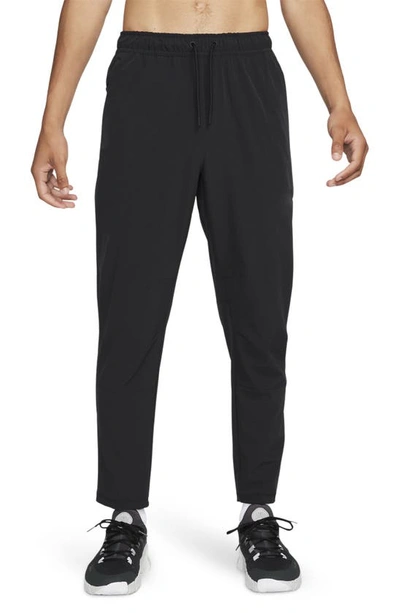 Nike Men's Unlimited Dri-fit Tapered Leg Versatile Pants In Black/ Black/ Black