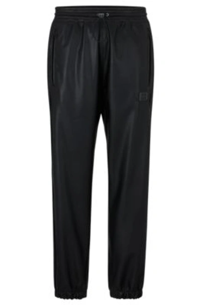 Hugo Faux-leather Tracksuit Bottoms With Framed Logo In Black