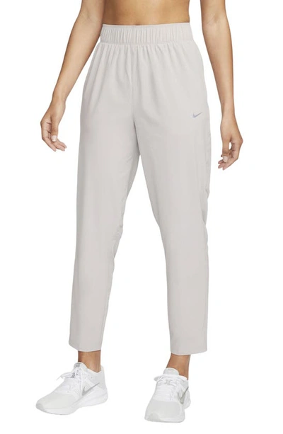 Nike Women's Dri-fit Fast Mid-rise 7/8 Running Pants In Light Iron Ore