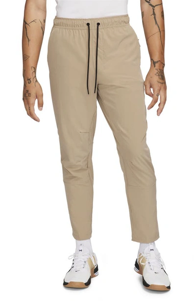 Nike Men's Unlimited Dri-fit Tapered Leg Versatile Pants In Brown