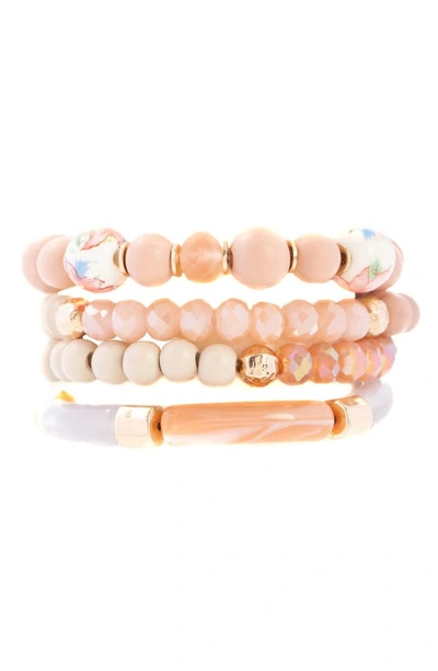Saachi Set Of Four Wood Beaded Bracelets In Pink