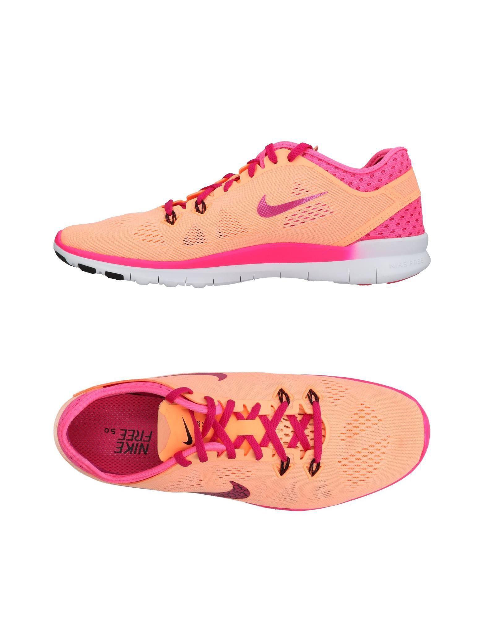salmon colored nike shoes