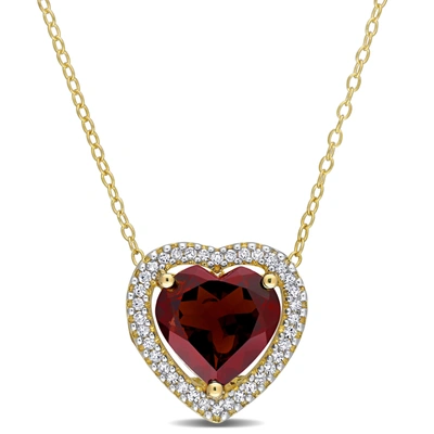 Mimi & Max 3 4/5 Ct Tgw Garnet And 1/5 Tw Diamond Halo Heart Necklace With Chain In Yellow Plated Sterling Silv In Red