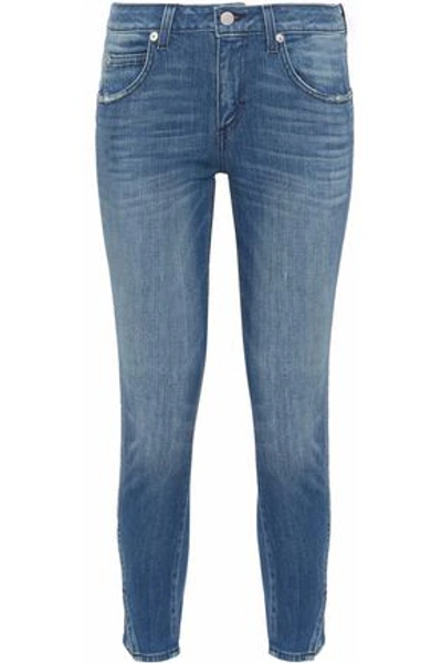 Amo Twist Distressed Mid-rise Skinny Jeans In Mid Denim