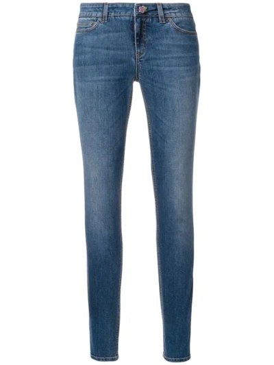 Dolce & Gabbana Skinny Jeans With Floral Button In Blue