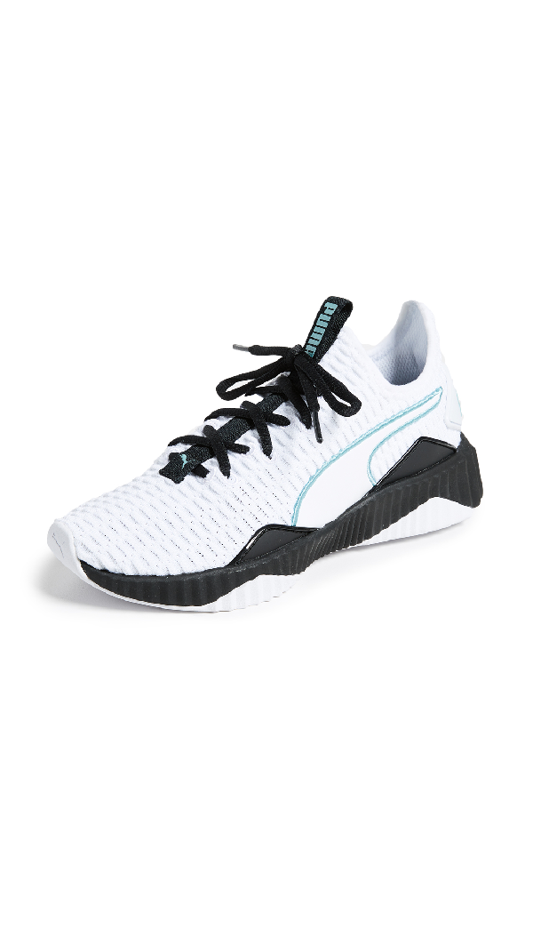 white puma shoes with black stripe