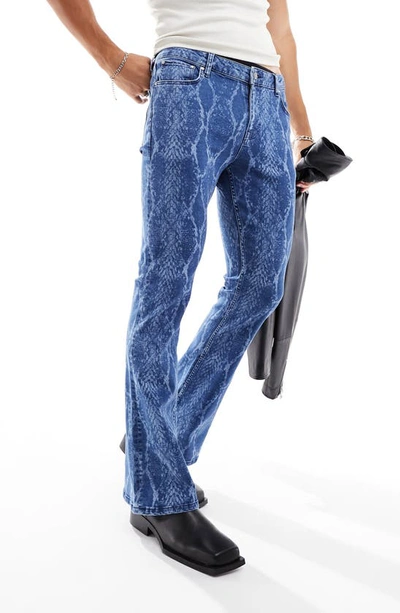 Asos Design Snakeskin Print Stretch Flare Leg Jeans In Mid Blue