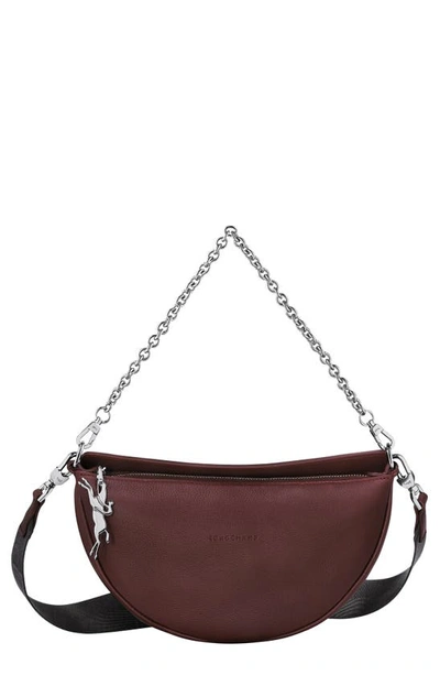 Longchamp Small Roseau Essential Soft Half Moon Leather Crossbody Bag In Plum