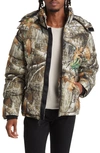 The Very Warm Gender Inclusive Hooded Puffer Coat In Original Camo