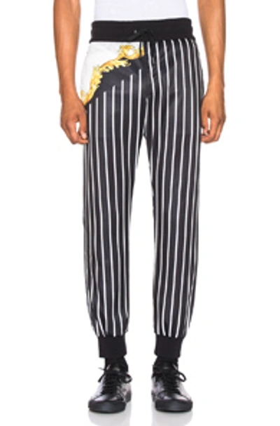 Versace Striped Printed Track Trousers In Black & White & Gold