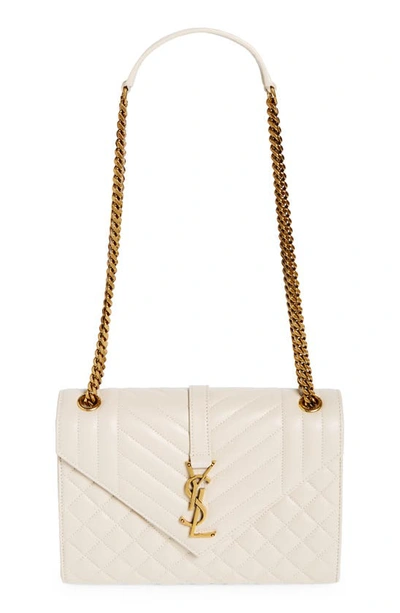 Saint Laurent Medium Cassandra Quilted Leather Envelope Bag In Crema Soft