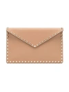 Valentino Garavani Poudre Pink Rockstud Grained Leather Envelope Clutch Bag In Nude