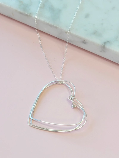 A Blonde And Her Bag Silver Hearts Necklace On A Silver Chain