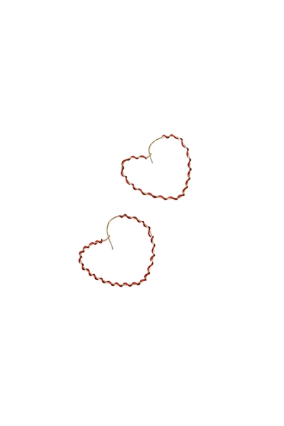 A Blonde And Her Bag Wrapped Around The Heart Earring In Gold With Red Wrap