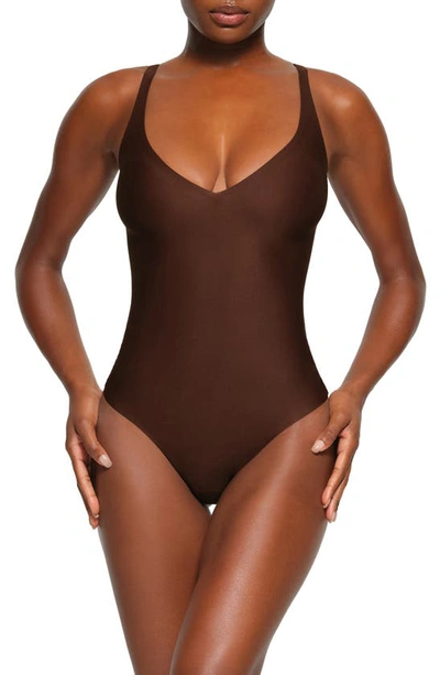 Skims Body Basics Plunge Thong Shaper Bodysuit In Cocoa