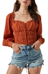 Astr Amber Puff Sleeve Smocked Blouse In Rust