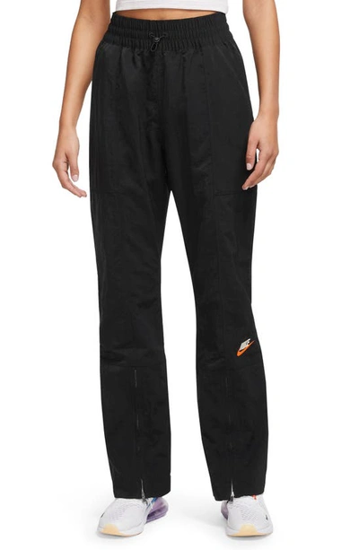 Nike City Utility Zip Cuff Track Pants In Black/ Black/ Safety Orange