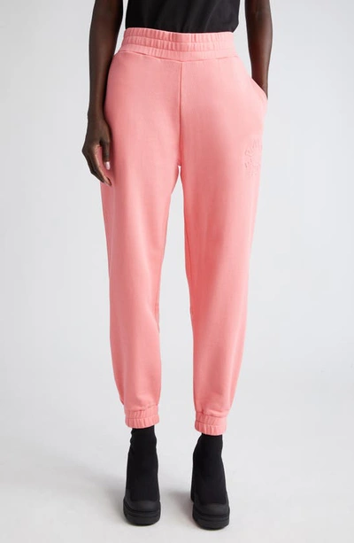 Moncler Embossed Logo Sweatpants In Pink