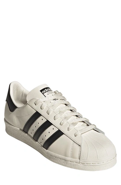 Adidas Originals Superstar 82 Low-top Sneakers With Perforated Toe Box In Cloud White/core Black/off White