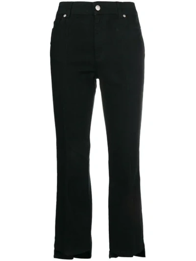 Alexander Mcqueen Cropped Kick-flare Step-hem Jeans In Black