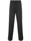 Prada Travel Edition Trousers In Grey